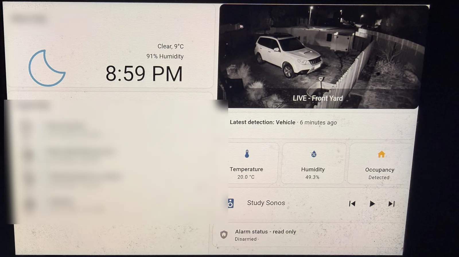 The finished Kiosk Satellite dashboard on the Echo Show 8, with weather, a live camera, room conditions, media controls and read-only alarm status.
